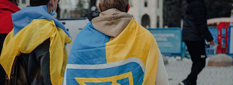 Person Wrapped in the National Flag of Ukraine