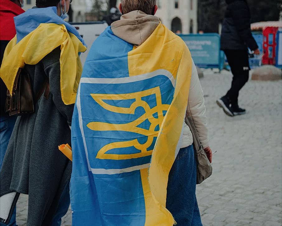 Person Wrapped in the National Flag of Ukraine